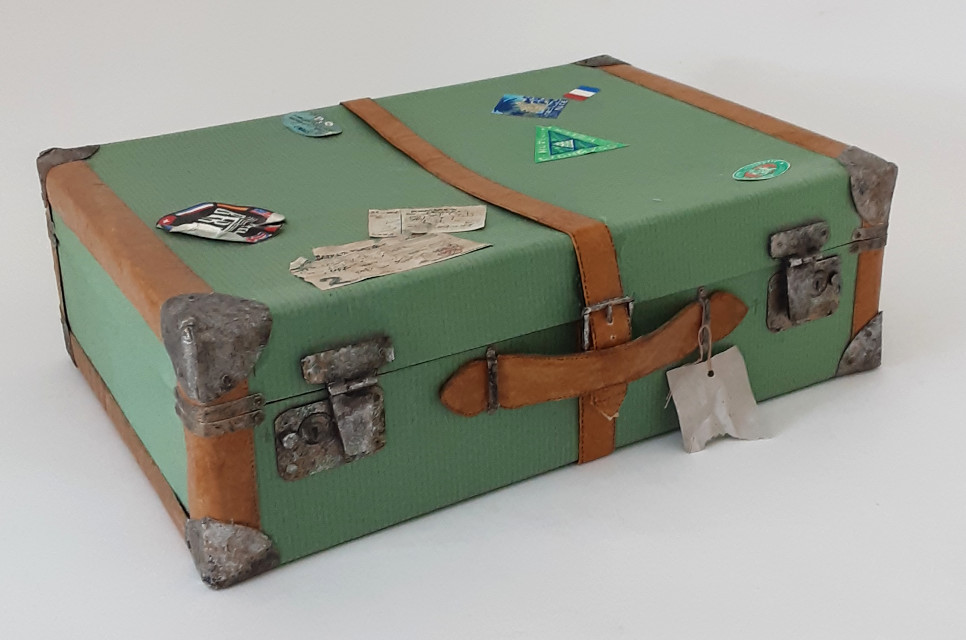 45. The first green suitcase